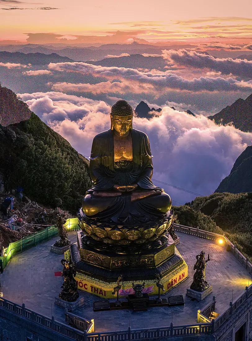 Buddha statue golden sunset sea of clouds Fansipan Sa Pa Vietnam