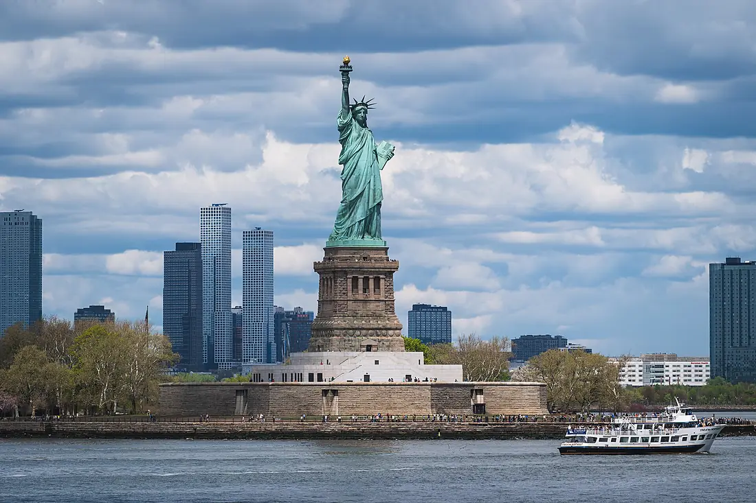 Statue of Liberty and a sightseeing boat, Liberty Island, New York