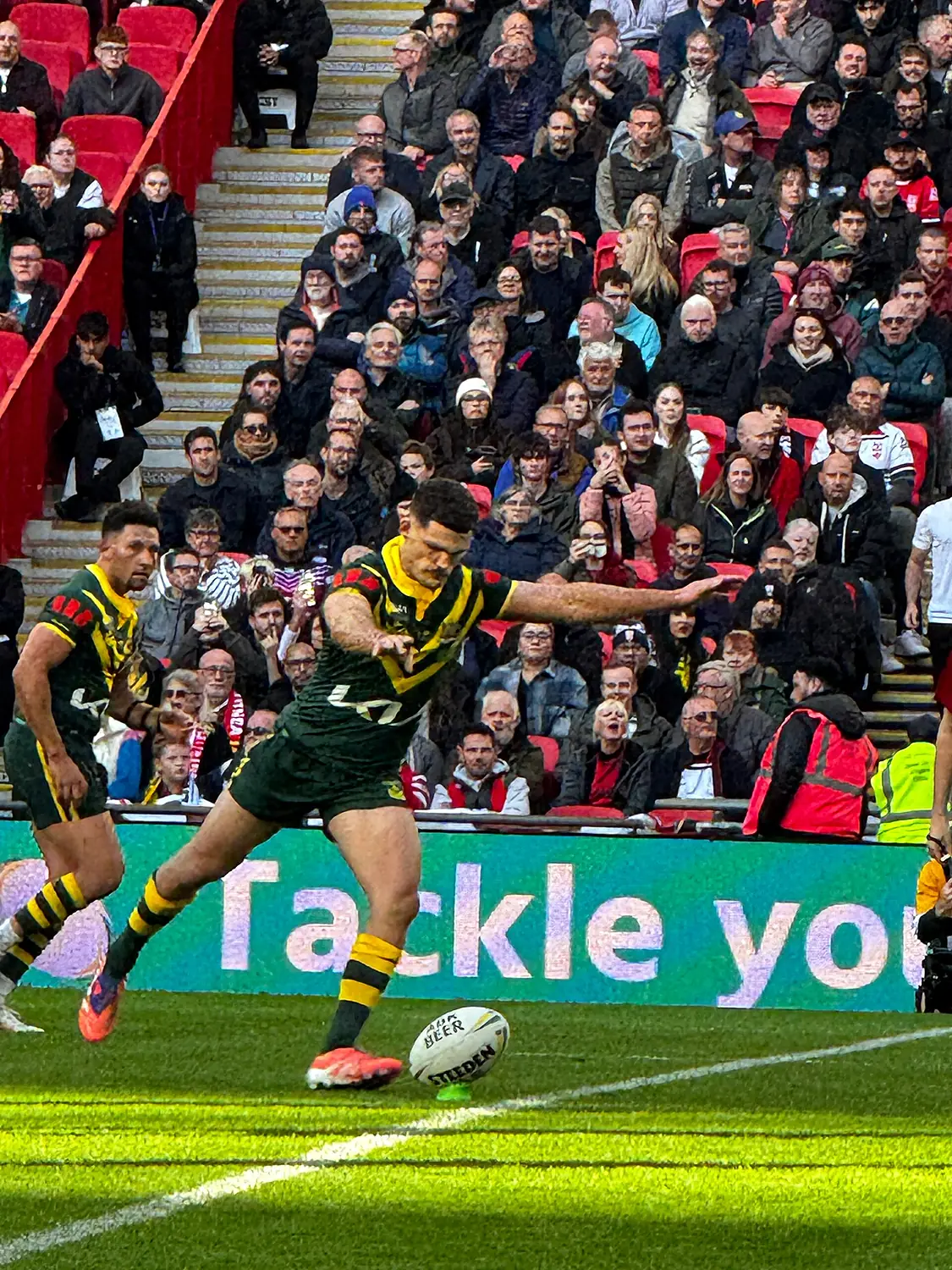 Nathan Cleary kicking at goal for Australia